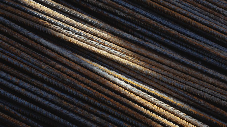 Stacked MS flat bars in sunlight